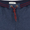Jean Bourget indigo fleece jog is warm and practical. The elasticated belt is punctuated with red stitching.