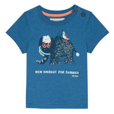 Blue cotton jersey t-shirt printed with a mammoth adorned with glasses on the front. Two buttons placed on the left shoulder. By Jean Bourget.