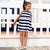 Pleated Striped Dress For Girls. Round neckline. Small opening on the back with a button fastening to allow the garment to be put on easily. Flowing chiffon fabric.