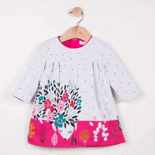 Catimni dress made of soft marl jersey with tiny spots, a small imaginary flowery animal falls asleep. Box pleats on the shoulders. Round neck with pink binding. Printed pattern placed in front and on the bottom. Invisible back zip.