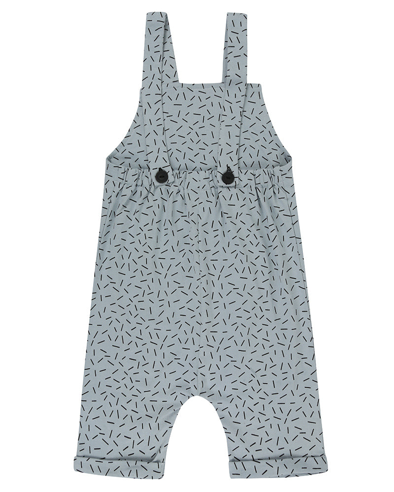 Unisex organic cotton short overalls in blue and white sprinkle print with a striped patch in the front. Shop TurtleDove London now.