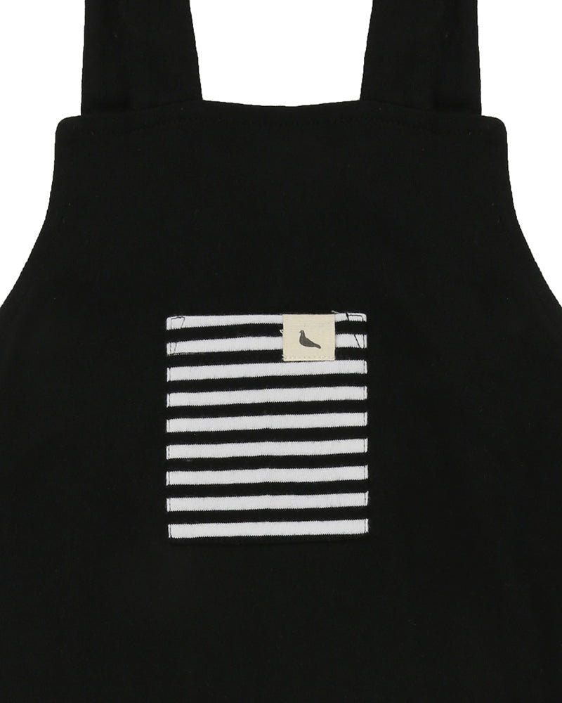 Unisex organic cotton short overalls in black with a striped patch in the front. Shop TurtleDove London now.