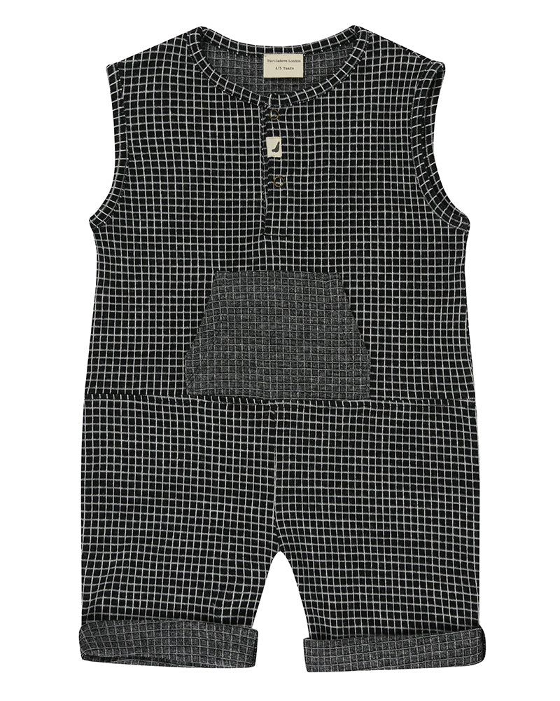 Unisex organic cotton black and white checkered playsuit with a grey pocket in the front and short sleeves. Designer TurtleDove London.