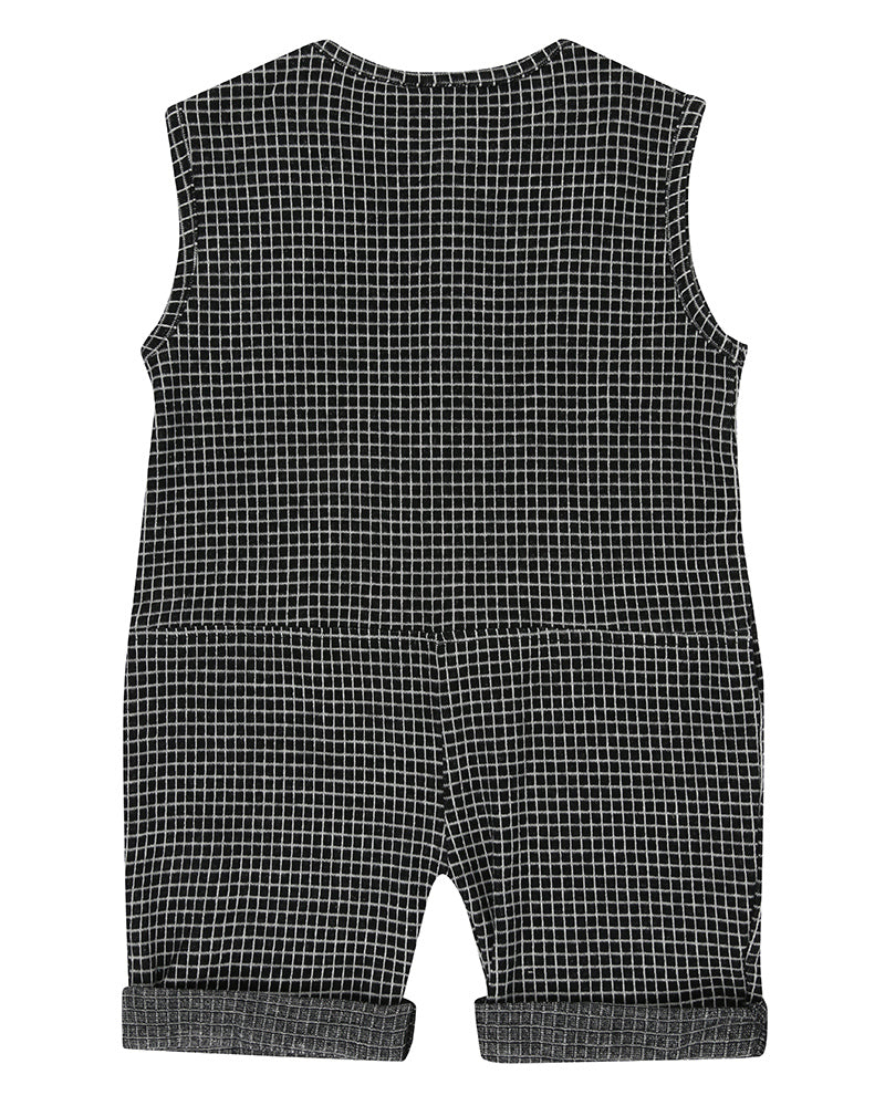 Unisex organic cotton black and white checkered playsuit with a grey pocket in the front and short sleeves. Designer TurtleDove London.