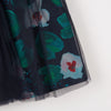 knee-length skirt in tulle on percale printed with flowers for a chic girls' look. Double plain tulle on printed percale. Sequinned elastic waistband. Catimini Label.