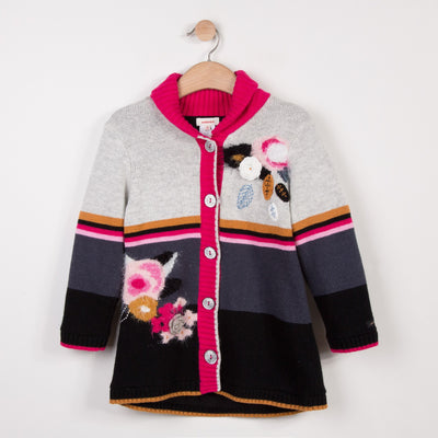 Jacket in soft and fluffy knit, with multicolored jacquard patterns. Soft, warm and padded fleece lining and two patch pockets. Catimini signature colors.