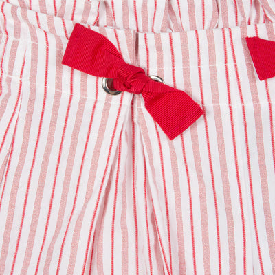 Jean Bourget spring shorts in ecru cotton voile are punctuated with red poppy stripes and enhanced with metallic lurex. Two large folds structure the cut to bring a fluid and light volume.