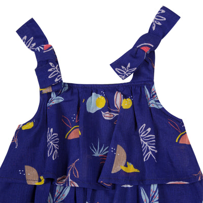 Ultramarine cotton-crepe dress is printed with a cheerful, exotic pattern of birds and tropical plants all over. Designed by Jean Bourget.