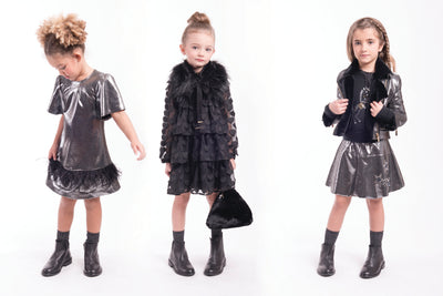 Black heart tiered chiffon A-line dress with an empire waist and ruffled appearance. Dress by Imoga.