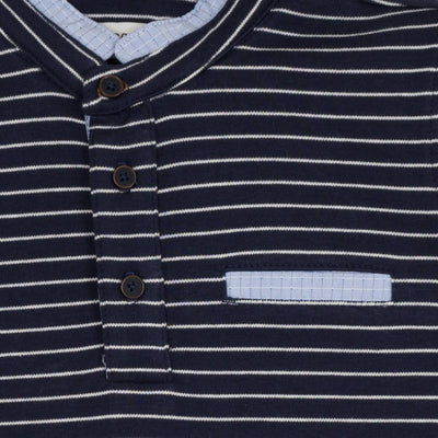 Jean Bourget navy blue long-sleeved polo shirt is punctuated with a sailor stripe. This classic look is twisted by a piped collar of light blue check fabric, matchin