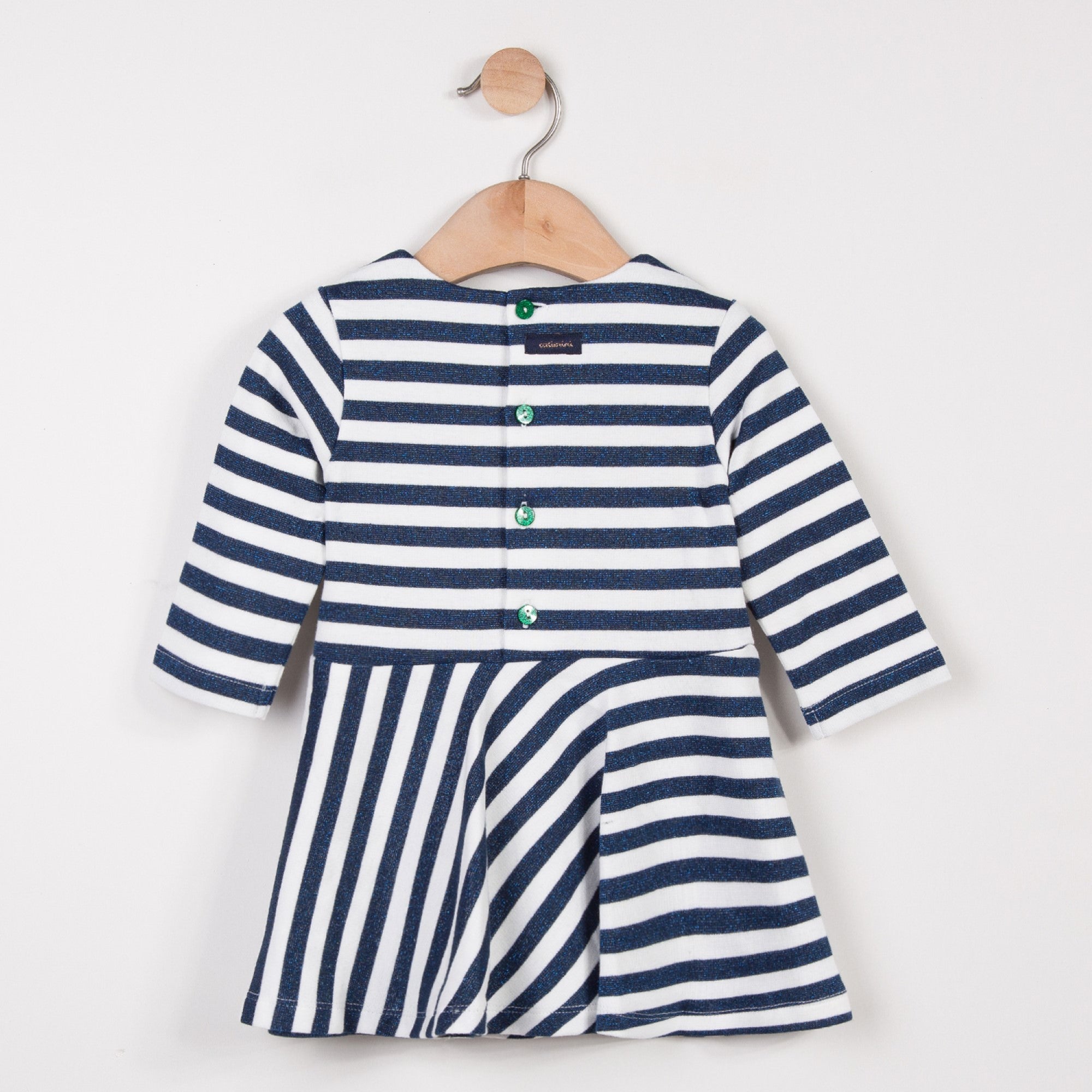 Long sleeve knit dress with glittering metallic stripes and small fairytale patches on the chest. Round neckline and sequinned buttons on the back. Catimini design.