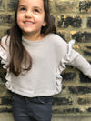 100% cotton top in grey outlined with ruffles down both sides. Designed by Vignette.
