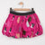 Catimini short bubble skirt in fuchsia with a stork print on a crepe lined bottom and elastic waistband.