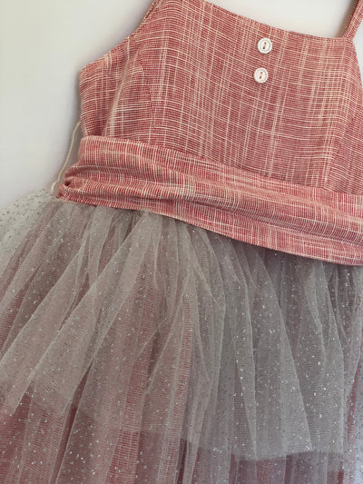 Girls rouge color tulle dress with large wrap around bow. This dress is by Vignette.