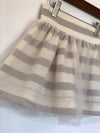 Girls grey and off-white skirt with wide stripes and tulle lining. Shop Vignette for girls.